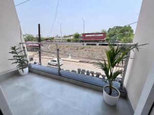 a balcony with a view of a train at Hotel Stayvilla Raipur in Raipur