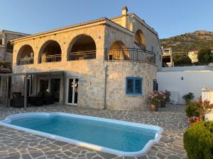 a house with a swimming pool in front of it at Villa Bavaria in Starigrad
