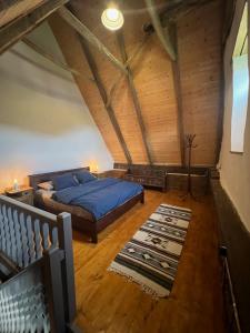 a bedroom with a bed in a attic at Archita 155 in Archita