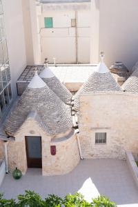 an outside view of a building with a roof at Trullo Màufra in Locorotondo