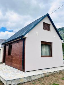 a white house with a red brick at Falcon Cottage,Montenegro in Korita +23 photos