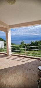 a balcony with a view of the ocean at Emma 2 in Budva