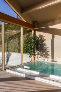 a swimming pool in the backyard of a house at Tan Rallt Holiday Park & Spa in Abergele