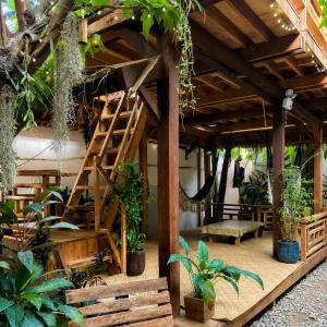a greenhouse with a bunch of plants and stairs at Wave Cafe INN in General Luna