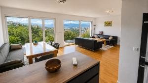 a living room with a couch and a table at Sarajevo Apartment in Sarajevo