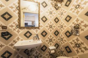 a bathroom with a sink and a mirror at 3BR Townhouse with Private Rooftop in Bormla in Taʼ Penza +40 photos