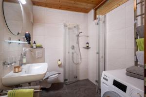 a bathroom with a sink and a shower at App. Fam. Dr. Goldberger in Söll +176 photos