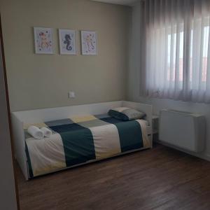 a small bedroom with a bed in a room at Casa das Flores in Batalha +57 photos