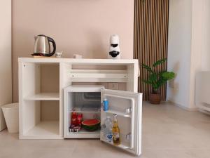 a white cabinet with an open door in a room at Sole Relax Pula in Pula