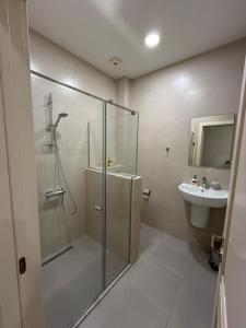 a bathroom with a shower and a sink at La Montagna in Bangveti +2 photos
