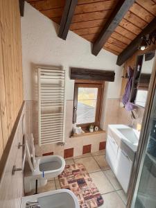 a bathroom with a sink and a toilet and a window at Belle vue des Alpes in Blavy +37 photos