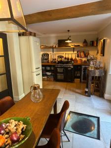 a kitchen with a table with a bowl of food on it at L'aile du Chateau in Ramatuelle