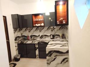 a bathroom with a large marble sink and mirrors at Ayubo Villa in Ja-Ela +18 photos