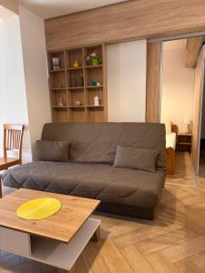 a living room with a couch and a table at Capri apartments in Kotor +29 photos