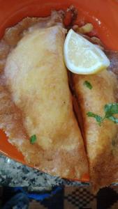 a plate of food with a lemon slice on top at La tente in Tamaghzah +31 photos