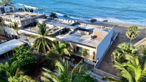 an aerial view of a house next to the ocean at Mora Mila in Arugam Bay