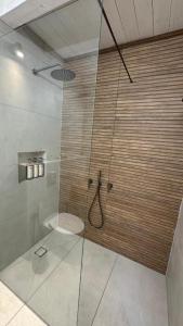 a bathroom with a shower with a toilet in it at צימר המשאלות בגלבוע in Nurit +5 photos