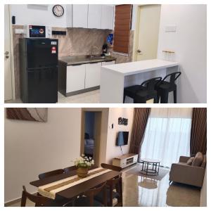 a kitchen and a living room with a table at Afa Homestay Melaka in Malacca