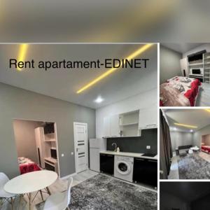 a room with a kitchen and a room with a bed and a room with at APARTMENT CENTRAL zm in Edineţ
