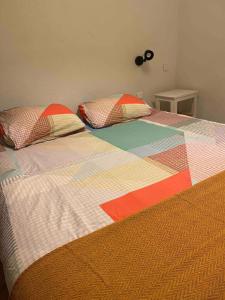 a bed with two pillows on top of it at Montana Appartment in Planay