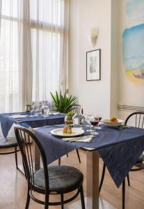 a dining table with a blue table cloth on it at Vibe Hotel in Cattolica