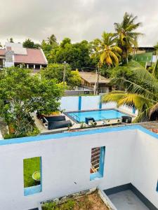 an aerial view of a house with a swimming pool at FEEL Villa in Kalutara