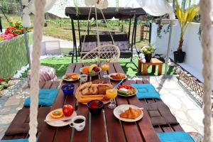 a picnic table with breakfast foods on it at La Rosalie in Astris