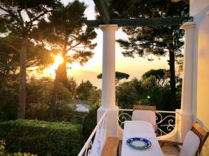 a view of the sunset from the porch of a house at Villa due rami in Anacapri