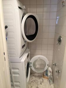 a small bathroom with a toilet and a mirror at home santos in Tulle