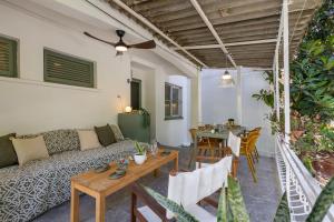 a living room with a couch and a table at 7a old Marmaris house in Marmaris