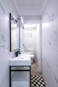 a bathroom with a sink and a mirror and a toilet at 7a old Marmaris house in Marmaris +70 photos
