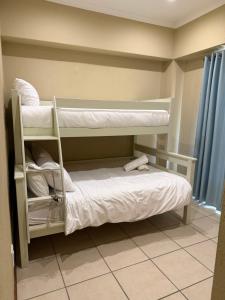 a room with two bunk beds in a room at Caly Luxury Home in Nelspruit