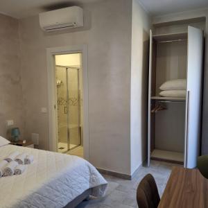 a bedroom with a bed and a sliding glass door at Antica Dimora Ceri in Ceri