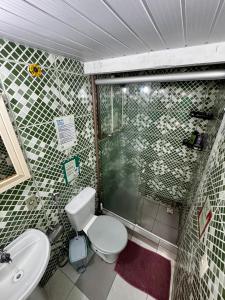 a bathroom with a toilet and a sink at Hostel New Ipanema in Rio de Janeiro +41 photos