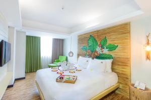 Ένα ή περισσότερα κρεβάτια σε δωμάτιο στο MaxOneHotels at Ubud - CHSE Certified