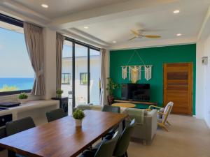 a living room with a table and chairs and a couch at V36A Horizon in Haad Yao