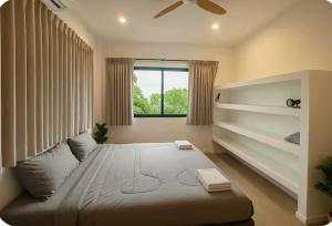 a bedroom with a large bed and a window at V36A Horizon in Haad Yao +24 photos