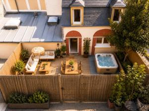 an aerial view of a backyard with a hot tub at TOWNHOUSE TROUVILLE - Appart'Hotel & Spa in Trouville-sur-Mer