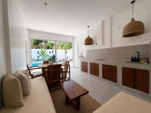 a kitchen and dining room with a table and chairs at Pineale Villas, Resort and Spa in Panglao Island