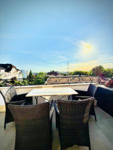 a table and chairs on a balcony with a view at Parkresidenz Viktoria Luise in Bad Salzuflen