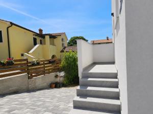 a stairway leading up to a house at Apartment Mare Paola in Medulin