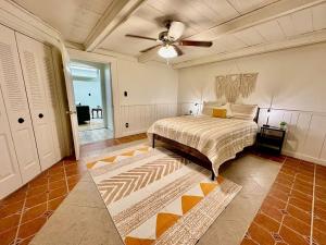 a bedroom with a bed and a ceiling fan at Newly Renovated Quiant 2-bed 2-bath Apt in Wilmington