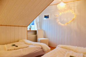 Postel nebo postele na pokoji v ubytování Guesthouse Árný