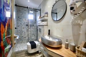 a bathroom with a sink and a shower at Manolo & Jolie Luxury Villa in Himare +106 photos