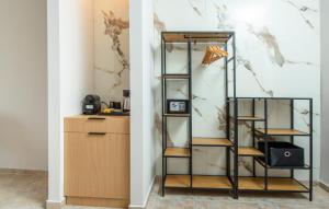 a room with a book shelf and a desk at Sokrates Studios in Afantou