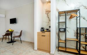 a room with a desk and a table with a chair at Sokrates Studios in Afantou