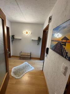 a hallway with a door open to a room at Spessartblick in Heimbuchenthal