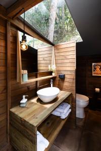 a bathroom with a sink and a toilet at Sirio in San Francisco +5 photos