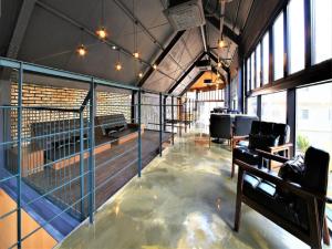 a large room with a dog cage in a building at Elysee Hotel in Busan