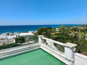 a view of the ocean from the balcony of a house at Villa Stella in Torre Vado